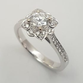 Marry Me Package C : Platinum deco style ring with cenral claw set diamond, heart detail and diamond mele