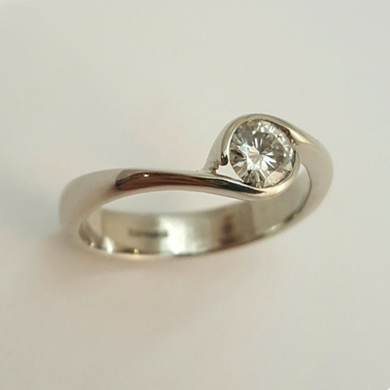 Package C: Platinum twist with brillaint cut diamond.